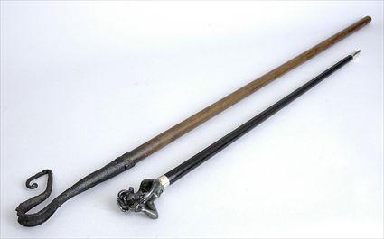 Appraisal: WROUGHT IRON HANDLED WOOD STAFF AND A WALKING STICK The