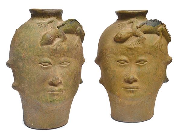 Appraisal: PAIR OF EARTHENWARE HEAD SHAPED VASES WITH SALAMANDER DETAIL CM