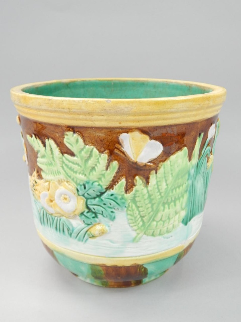 Appraisal: A Victorian majolica jardiniere decorated in relief with lilies other