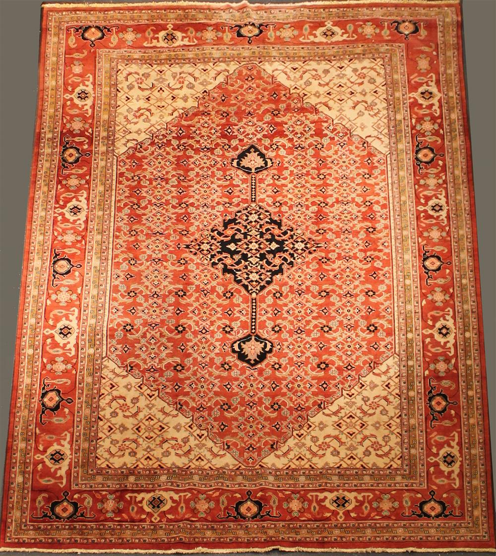 Appraisal: PAKISTANI HERIZ WOOL RUG having rust green pink black taupe