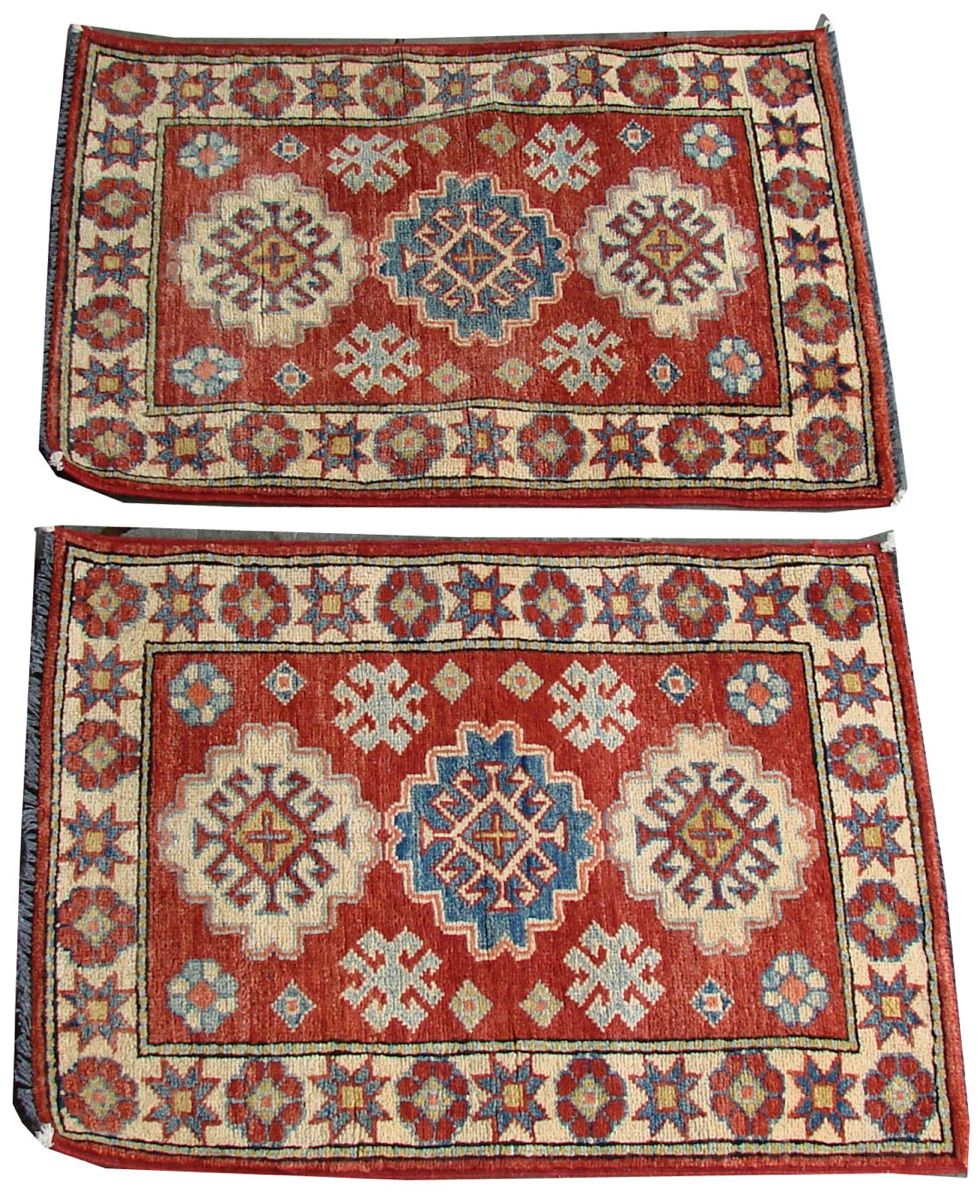 Appraisal: PAIR OF ORIENTAL RUGS KAZAK DESIGN MATS Approximately ' x