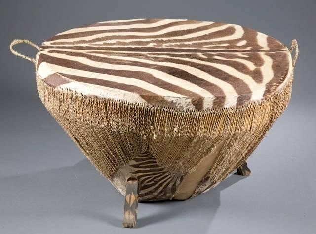 Appraisal: African Zebra hide drum table An exotic African zebra hide