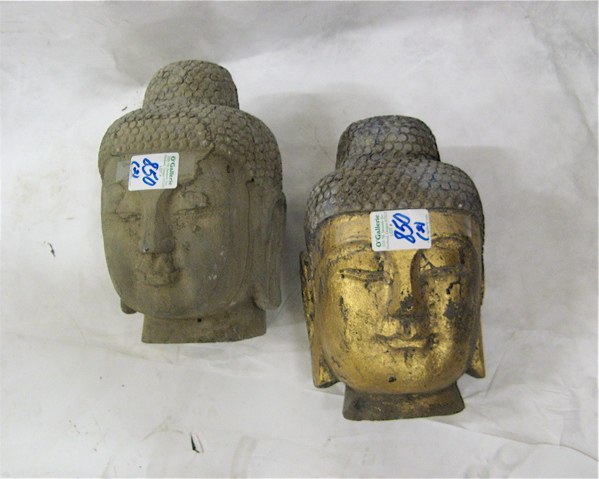 Appraisal: TWO GRANITE SCULPTED BUDDHA HEADS each with elongated ear lobes