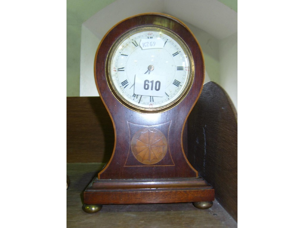 Appraisal: An inlaid Edwardian mantle clock with balloon shaped case enamel