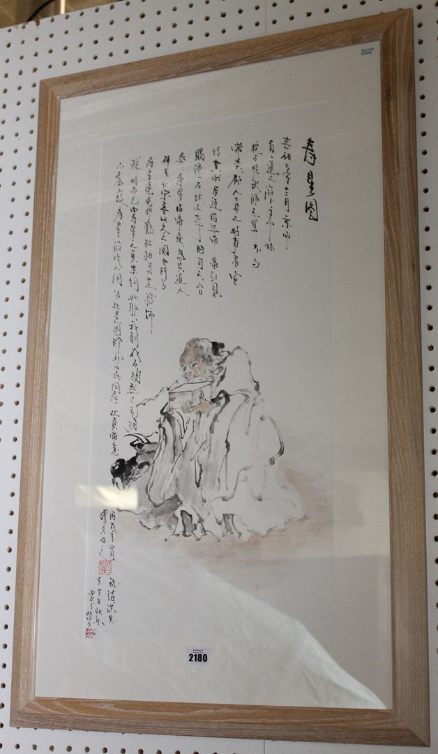 Appraisal: A Chinese painting of a seated scholar and calligraphy x