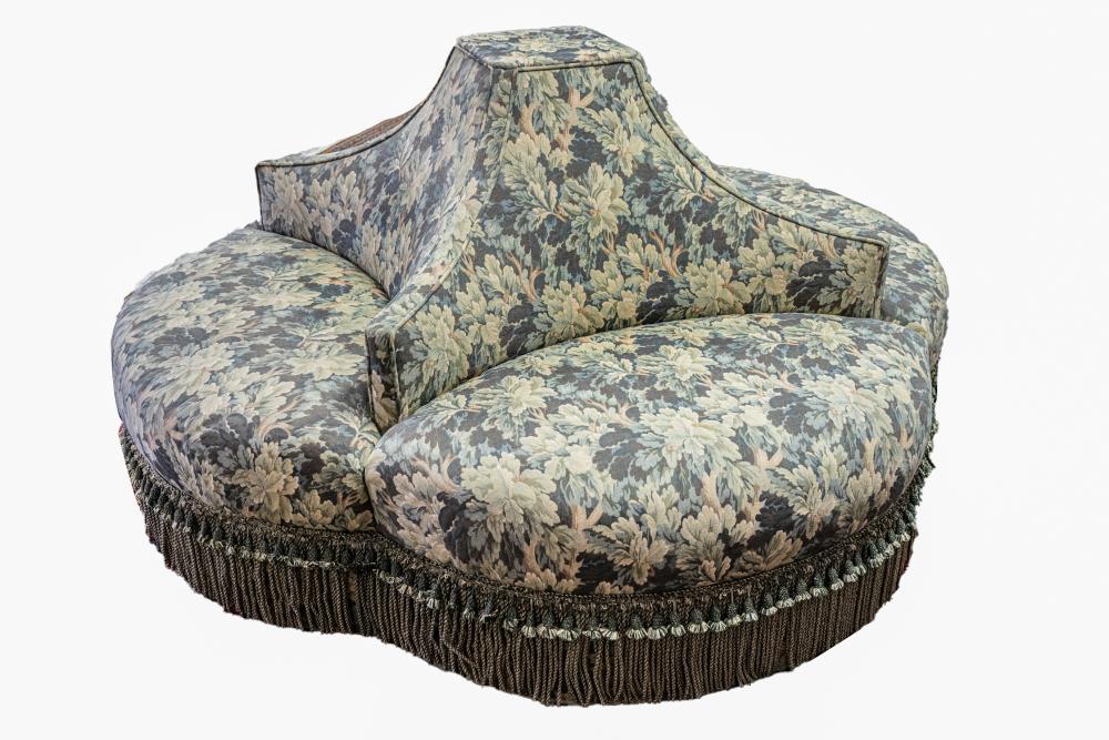 Appraisal: UPHOLSTERED TETE-E-TETEwith four arms covered with verdure-style tapestry fabric inches