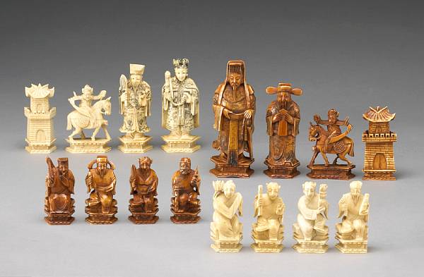 Appraisal: A carved and tinted ivory chess set th Century The