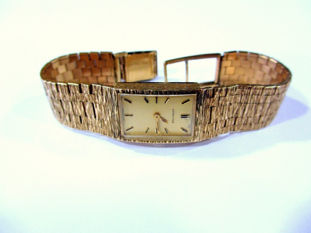 Appraisal: A ladies Longines ct golf bracelet watch with baton numerals