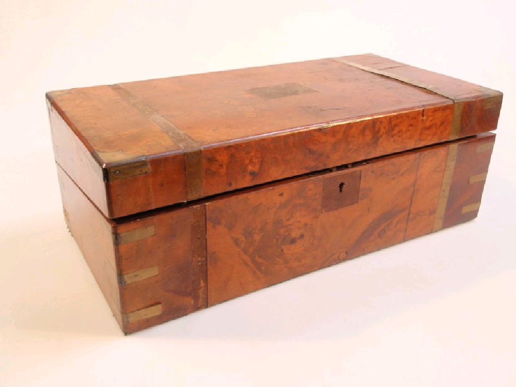 Appraisal: A Victorian burr walnut writing box with brass banding the