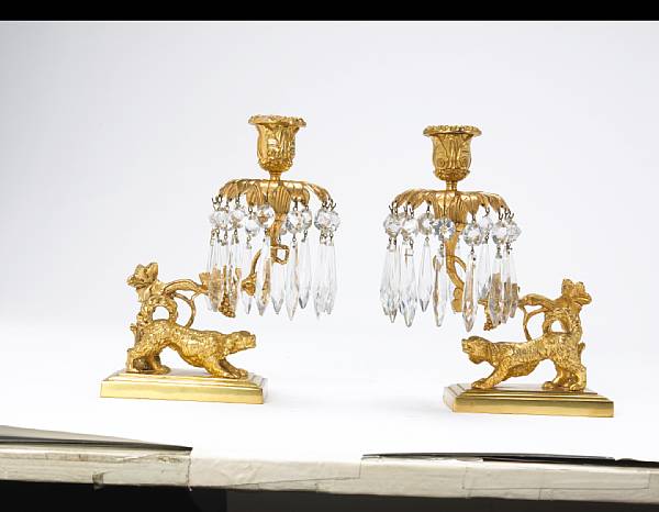 Appraisal: A pair of Regency style gilt bronze and glass girandoles