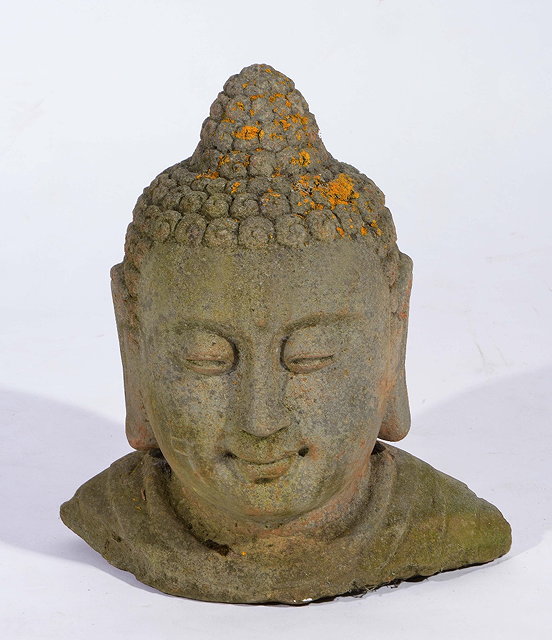 Appraisal: A CHINESE CARVED STONE BUDDHA'S HEAD th Century cm high