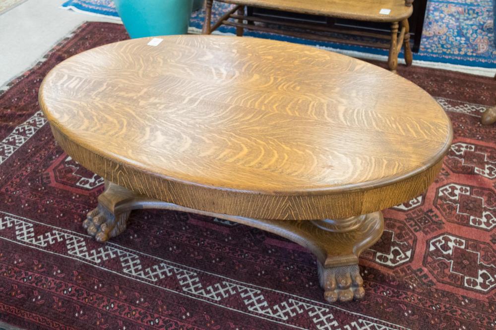 Appraisal: OVAL OAK COFFEE TABLE American c having a single drawer