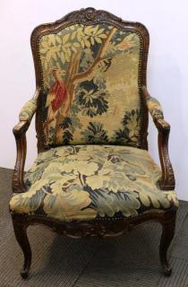 Appraisal: Antique Continental Upholstered Arm Chair The carved fruitwood frame with