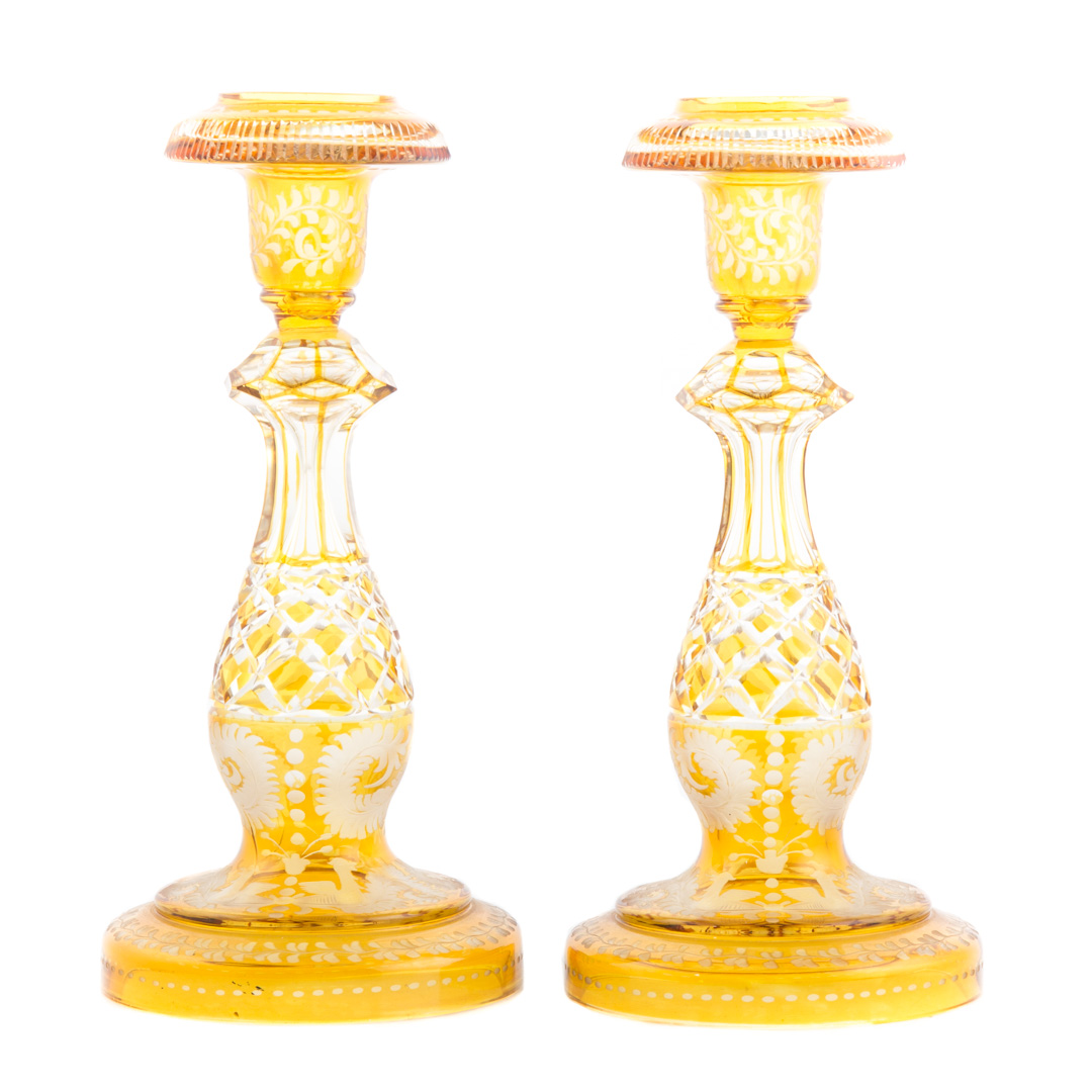 Appraisal: Pair Bohemian glass candlesticks amber cut to clear in H