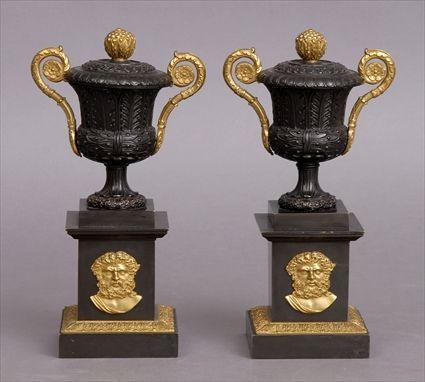 Appraisal: PAIR OF EMPIRE-STYLE GILT-METAL MOUNTED BRONZE URNS Each acanthus leaf