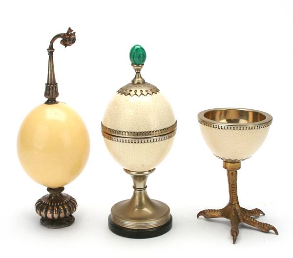 Appraisal: A group of three white metal mounted ostrich eggs height