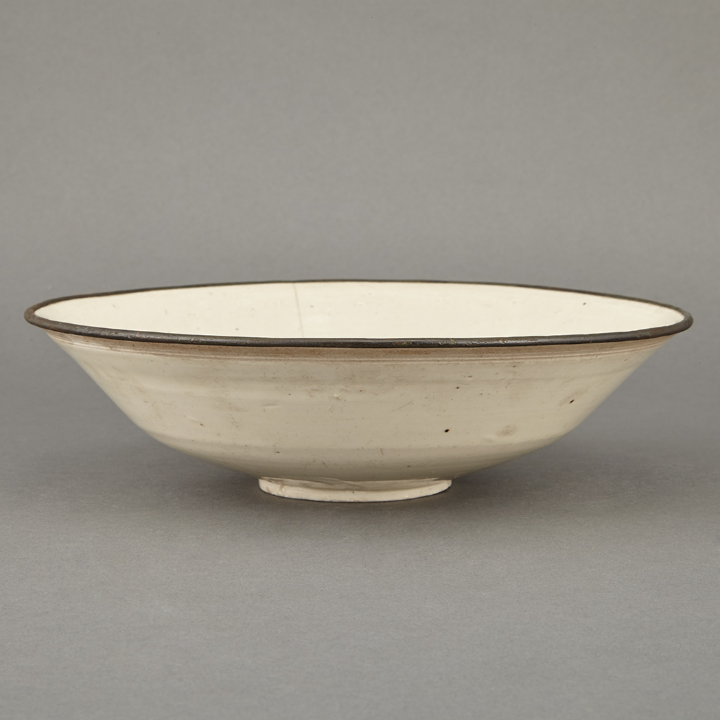 Appraisal: Asian Dingyao Style Bowl The gently flared sides rising to