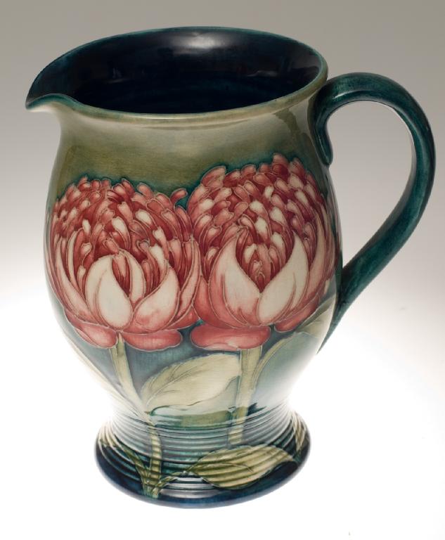 Appraisal: WALTER MOORCROFT POTTERY WATER JUG 's WARATAH PATTERN of baluster