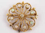 Appraisal: A yellow metal tests carat gold opal and diamond brooch