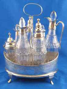 Appraisal: A seven bottle Georgian silver cruet frame the frame maker's