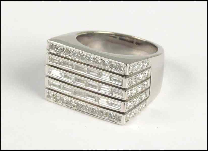 Appraisal: KARAT WHITE GOLD AND DIAMOND RING Baguette diamonds are VS-SI