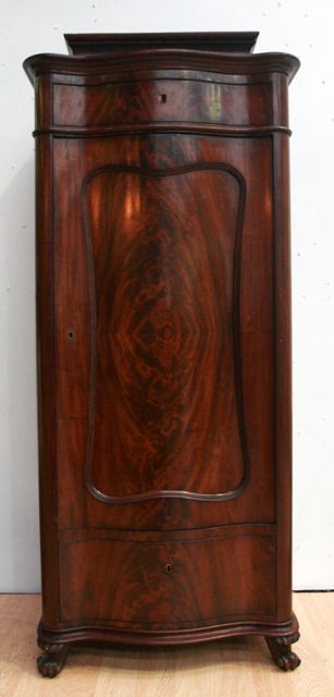 Appraisal: A French mahogany serpentine fronted cabinet second quarter th century