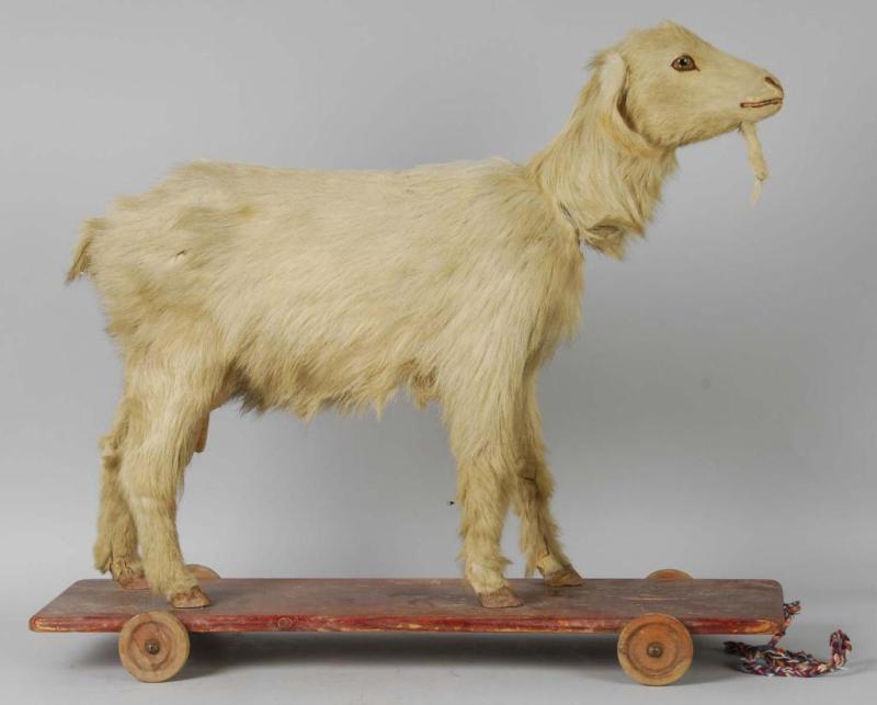 Appraisal: Large Goat Pull Toy Nodder Description On wooden platform with