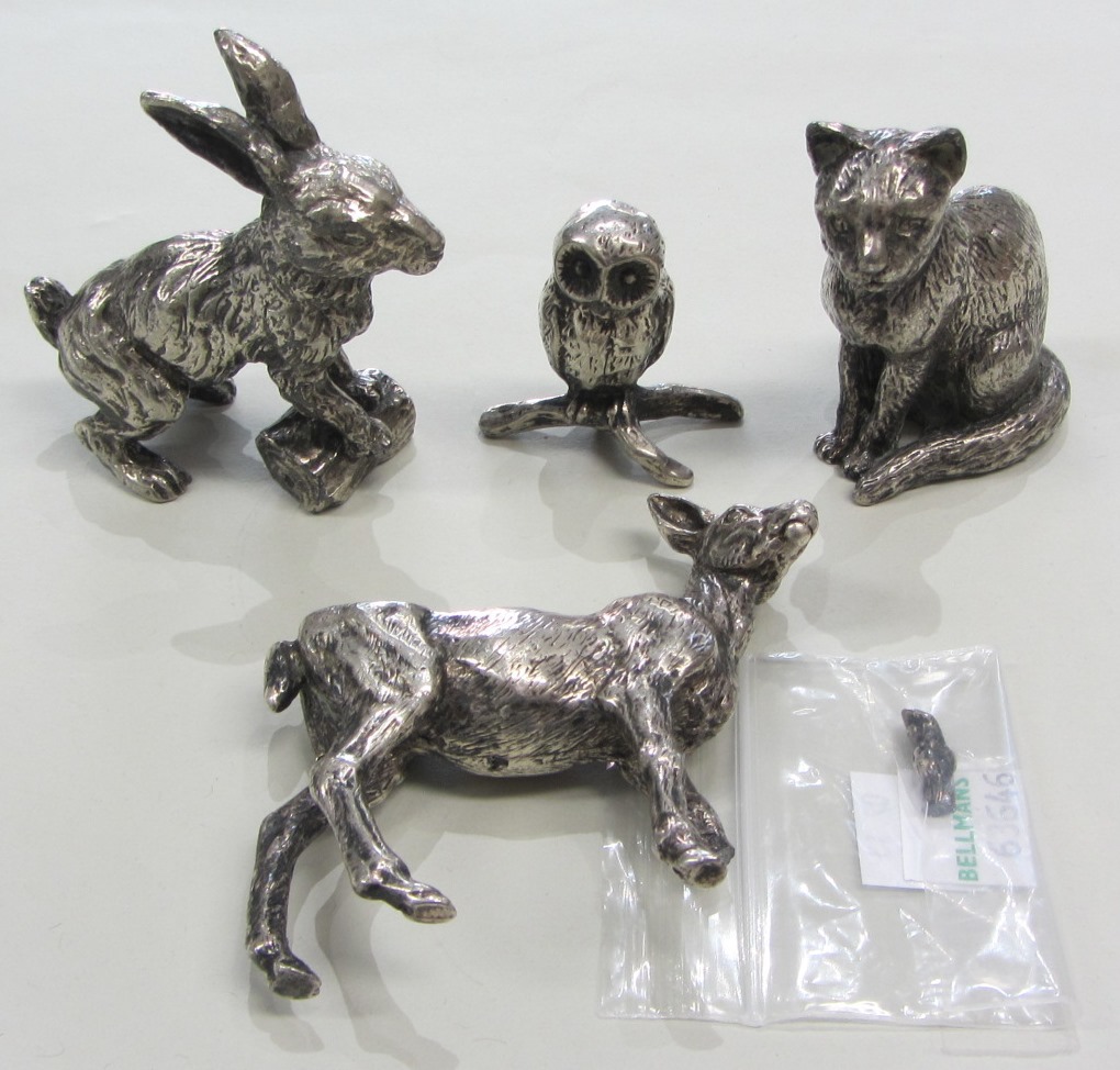 Appraisal: Four plated models of animals comprising a seated cat a