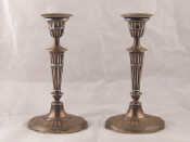 Appraisal: A pair of Edwardian silver candlesticks in the Adam manner