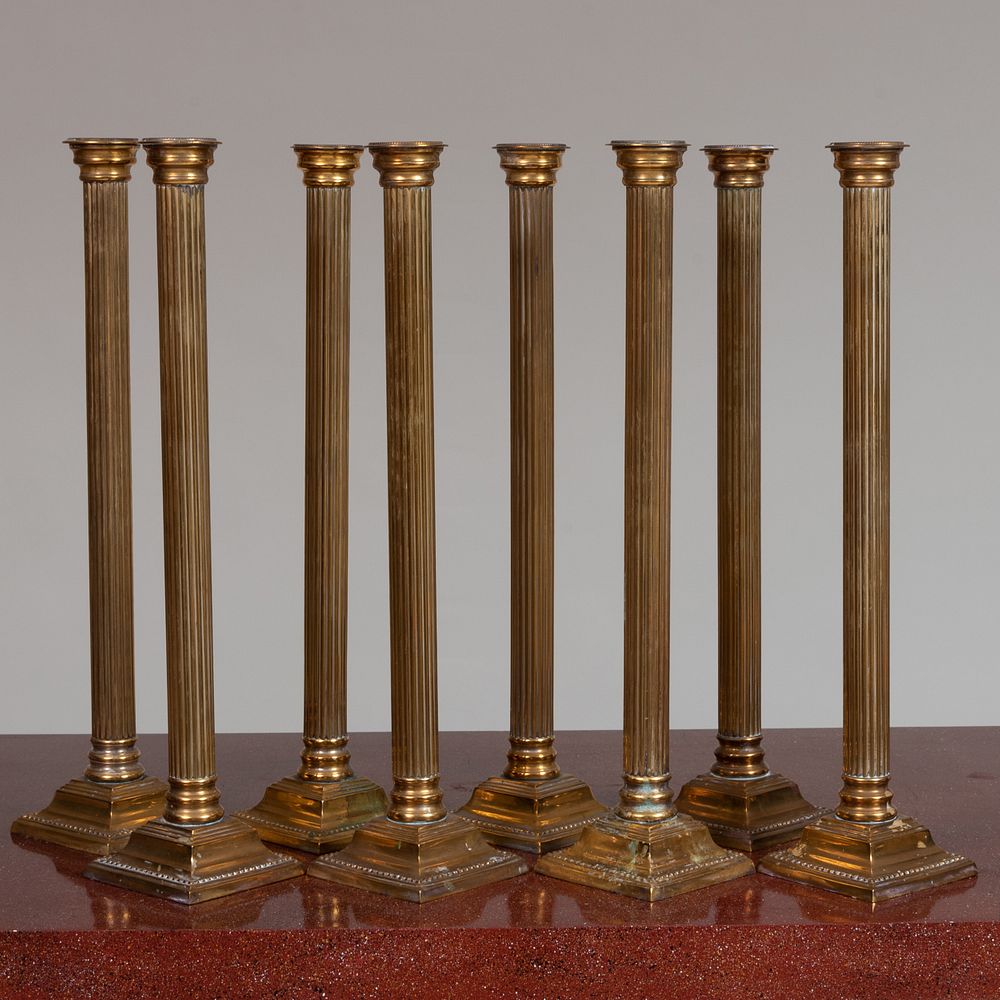 Appraisal: Group of Eight Tall Brass Reeded Columnar Candlesticks Probably English