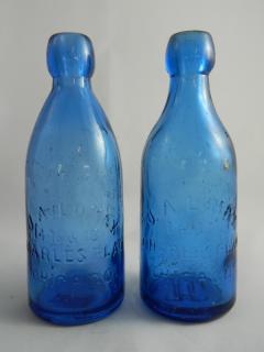 Appraisal: Soda blue bottles Soda- blue J A Lomax- marked 'J