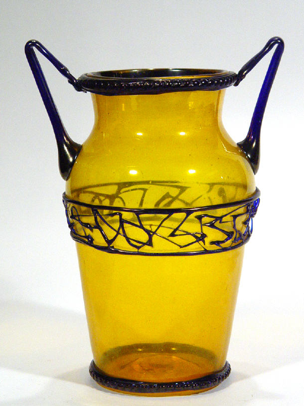 Appraisal: Unusual amber glass vase with twin iridescent blue glass handles