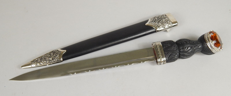 Appraisal: A modern Scottish short sword with simulated leather scabbard plated