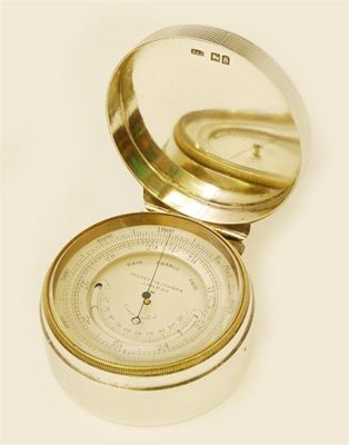 Appraisal: Negretti Zambra A pocket aneroid barometer with a silvered dial