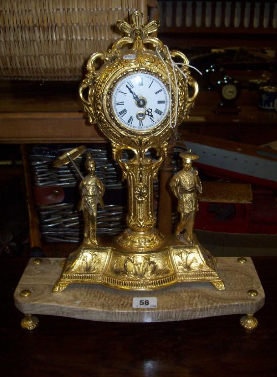 Appraisal: A gilt mantel clock decorated with Oriental figures on a