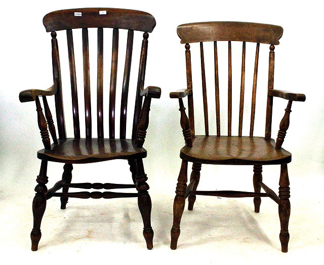 Appraisal: TWO ELM AND ASH COUNTRY ELBOW CHAIRS one with a