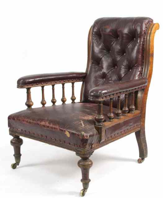 Appraisal: A Victorian mahogany library chair with galleried sides and upholstered