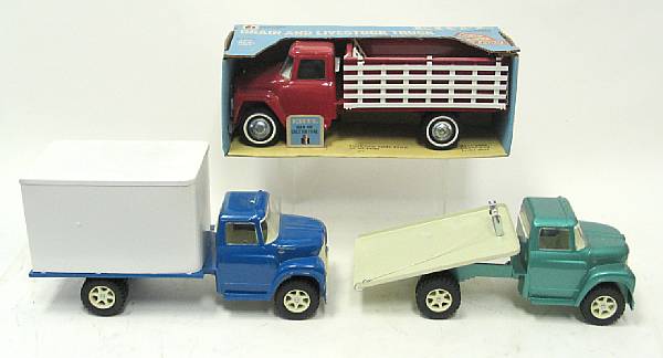 Appraisal: Ertl pressed steel trucks Lot includes a stake truck dump