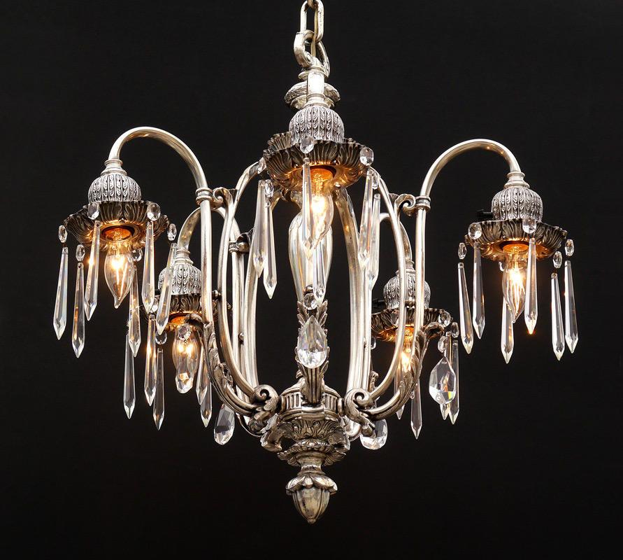 Appraisal: LIGHT SILVERED ROCOCO STYLE CHANDELIER Silver toned cast metal with