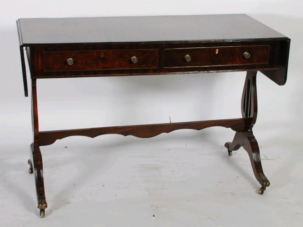 Appraisal: GEORGIAN STYLE MAHOGANY SOFA TABLE typical form with reeded top