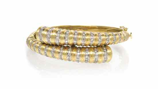 Appraisal: An Karat Yellow Gold and Diamond Bypass Bracelet containing numerous