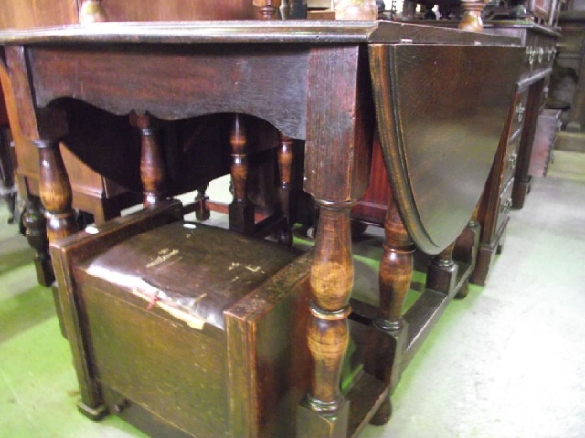 Appraisal: An outsized oak oval drop leaf gateleg dining table raised