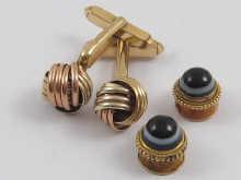 Appraisal: A pair of two colour carat gold knot cufflinks approx