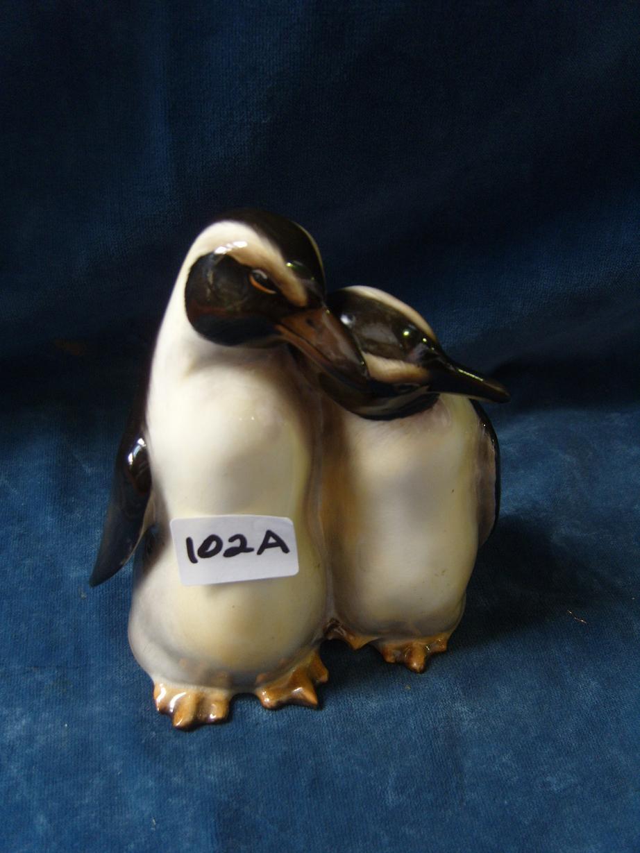 Appraisal: A Royal Doulton group of a pair of penguins HN