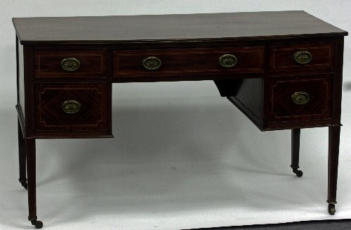 Appraisal: An Edwardian mahogany bowfront dressing table the kneehole base fitted