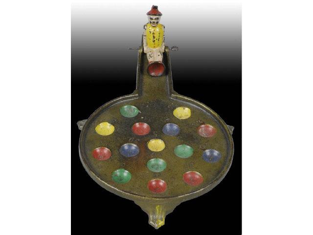 Appraisal: Cast Iron Mechanical Marble Game Description When marble is placed