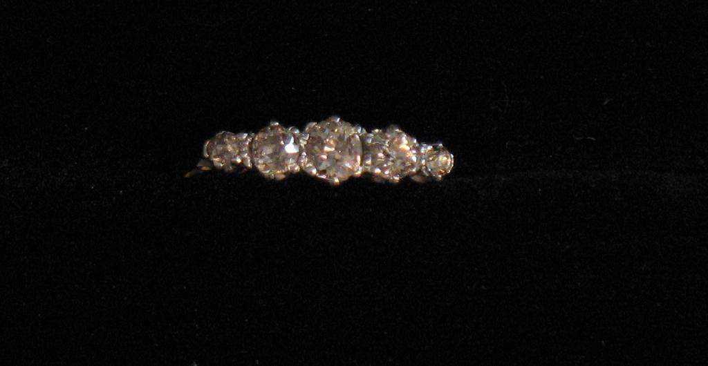 Appraisal: A FIVE STONE DIAMOND RING the central round old-cut diamond