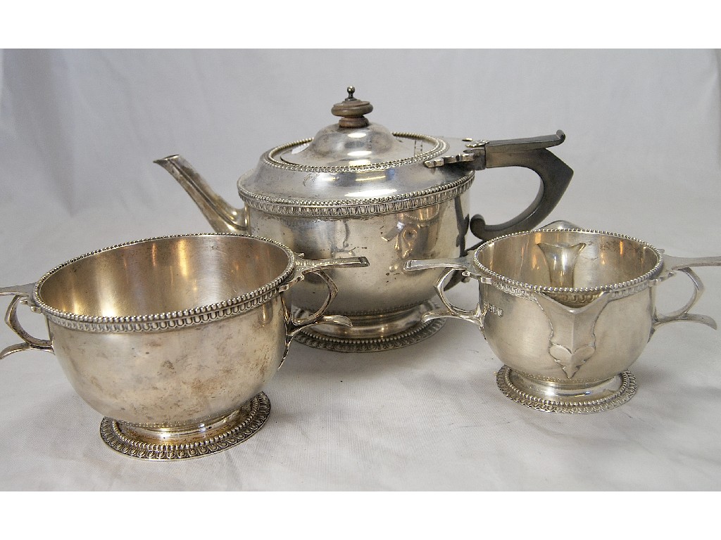 Appraisal: Unusual Edwardian silver three-piece teaset with gadrooned and beaded decoration