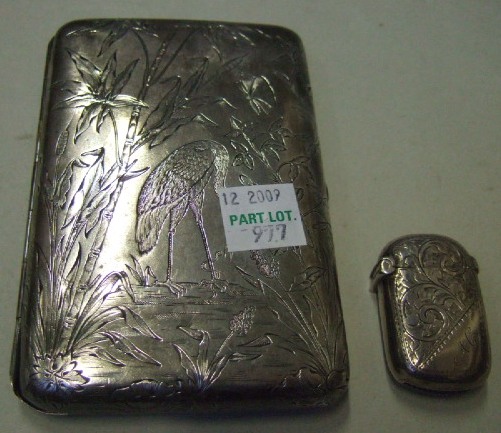 Appraisal: A Victorian silver rectangular case the exterior engraved with birds