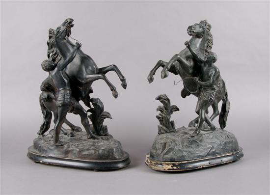 Appraisal: A Pair of Cast Metal Figural Groups Height overall inches